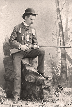 N.C. Nash with the Maynard Rifle included in the Coors Schuetzen rifle display cases currently on display in Cody, Wyoming.